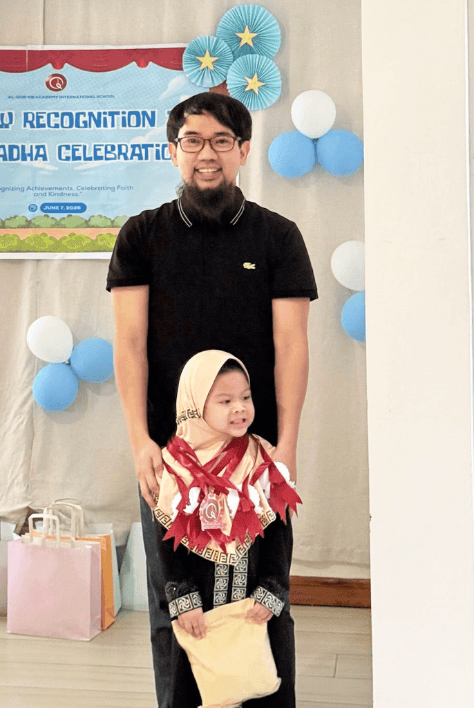 An AQA parent and pupil on recognition day